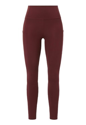 Burgunderfarbene Leggings aus elastischem Stoff. Hoher Bund mit Seitentaschen. Glatte Textur und knöchellanges Design. Keine sichtbaren Muster.