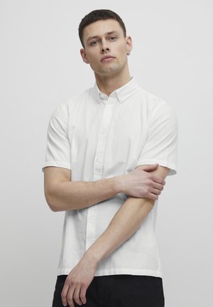 White short-sleeve shirt in lightweight fabric with a button-down collar, featuring a straight hem and minimalistic design.
