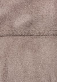 Taupe fabric with a soft, smooth texture, featuring a subtle sheen and consistent pattern across the surface. Stitched seam detail visible.