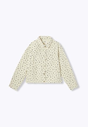 Veste beige clair avec de petites imprimés floraux sombres, col, dotée de boutons et de deux poches. Le tissu semble texturé et décontracté.