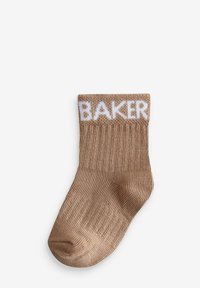 Braune gestrickte Socke mit geripptem Muster, ausgestattet mit einem weißen "BAKER"-Logo am Bündchen. Glatte Zehenpartie und flexibles Material für hohen Tragekomfort.