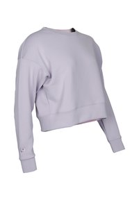 Kappa lila sweatshirt i cropped-modell, tillverkad av mjukt material. Den har rund hals, långa ärmar och en logotypdetalj på ärmen.