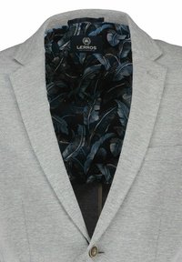 Light gray blazer with a notch lapel, featuring a black interior lining with blue leaf patterns and a single button closure.