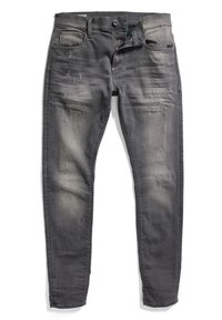 Harmaat slim-fit farkut, joissa on haalistumista ja kulutettuja yksityiskohtia, nappi ja vetoketju osittain auki, asetettu litteäksi valkoiselle taustalle.