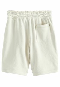 Cremfarbene Baumwollshorts mit elastischem Bund, einzelner Gesäßtasche und weichem, strukturiertem Stoff. Klassische, lässige Passform.