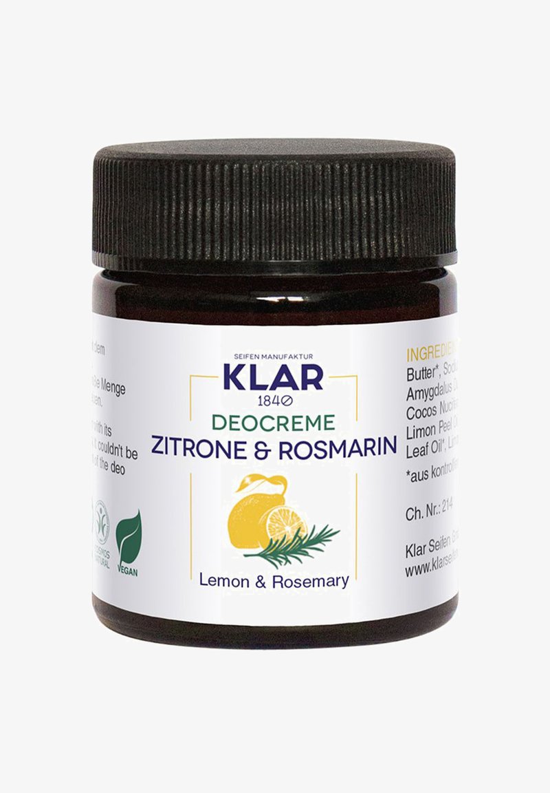 Dunkles Glasgefäß mit einem strukturierten schwarzen Deckel. Das weiße Etikett zeigt grüne und gelbe Schrift, die "Zitrone & Rosmarin" als Duft anführt. Das vegane Symbol ist enthalten.