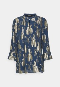 Μπλούζα ναυτικού στιλ με στρογγυλή λαιμόκοψη, μεταλλικό χρυσό αφηρημένο σχέδιο, μακριά μανίκια με βολάν και μπροστινό πλάκα με κουμπί κλεισίματος.