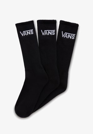 Calcetines Vans negros, paquete de tres, con textura acanalada, refuerzo en el talón y la puntera, y con el logo de Vans en blanco impreso cerca de la parte superior.