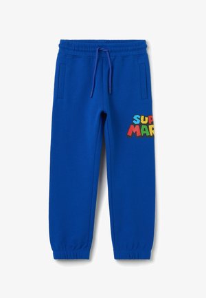 Blauwe sweatpants van zachte stof, met een elastische tailleband met trekkoord en kleurrijke "SUPER MARIO" tekst op de linker dij.