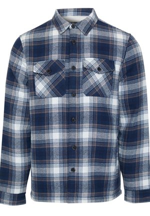 Chemise en flanelle à carreaux avec un motif plaid bleu marine, blanc et marron. Manches longues, fermeture à boutons sur le devant et deux poches sur la poitrine avec rabats.