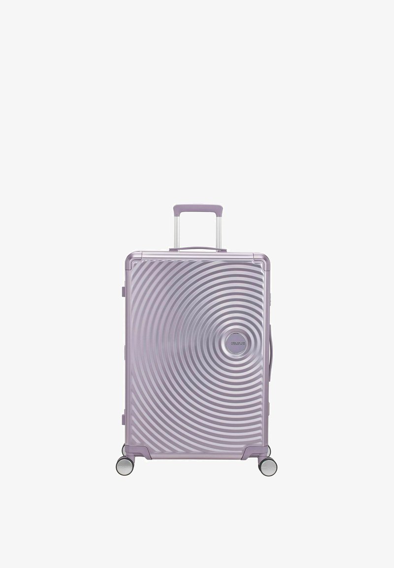 Valise rigide violette avec motif de cercles concentriques, poignée télescopique, quatre roues pivotantes et poignée latérale.
