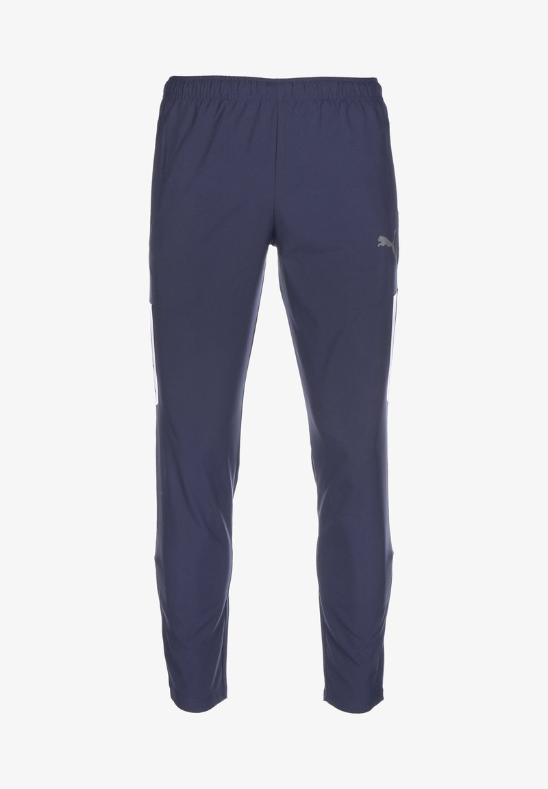 Donkerblauwe sportbroek met een elastische tailleband, zijzakken en een subtiele logodetail. Glad, lichtgewicht materiaal.