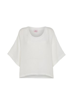 Witte top met korte mouwen en een losse pasvorm, gemaakt van een gestructureerde stof. Heeft een ronde halslijn en een zoom die iets langer is aan de achterkant.