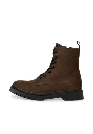 Braune Wildleder-Stiefeletten mit Schnürung vorne, runder Spitze und dicker schwarzer Gummisohle. Besitzt eine Zuglasche an der Ferse und strukturierte Seiten.