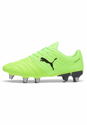 Neon green soccer cleat with a textured upper, black Puma logo, six metallic studs on the sole, and padded collar for support.