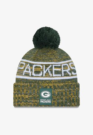 Knitted green and gold beanie with a white "PACKERS" band, topped with a green pom-pom. Features a green logo patch at the cuff.