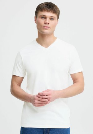 White cotton V-neck t-shirt with short sleeves, fitted design, smooth texture, and visible stitching detail on the hem.