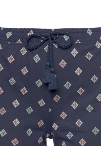 Shorts a fantasia navy con vita regolabile, caratterizzati da forme a diamante in colori pastello e due nappine alle estremità del cordino.