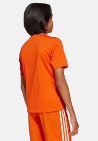 adidas Performance T-Shirt print - orangeweiss