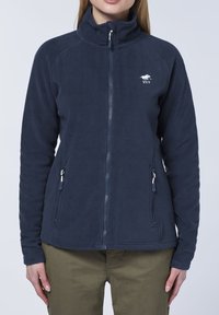 Navy fleece jacket with a high collar, full zipper, and two side pockets, featuring a white logo on the left chest. Smooth texture.