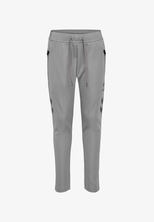 Grijze sportbroeken gemaakt van zacht materiaal, met een trekkoord in de taille, zijzakken en zwarte zigzagpatronen langs de zijkanten.