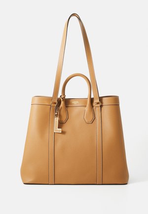 Tan leather tote with a pebbled texture, featuring dual top handles, long shoulder straps, and a gold tag detail. Reinforced stitching accents.