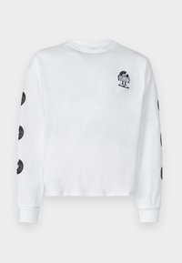 White long-sleeve t-shirt made of cotton, featuring a small black graphic on the front and black circular graphics on each sleeve.