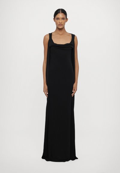 Robe maxi noire sans manches avec un décolleté carré et des détails drapés à l'avant. Tissu doux, forme fluide et design minimaliste.