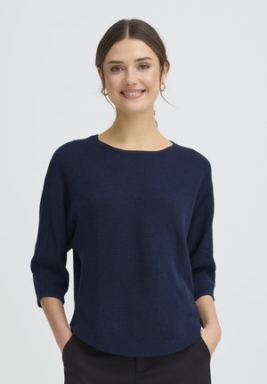 Navy blue knit sweater with a round neckline and three-quarter sleeves. Features a textured rib pattern, relaxed fit, and slouchy silhouette.