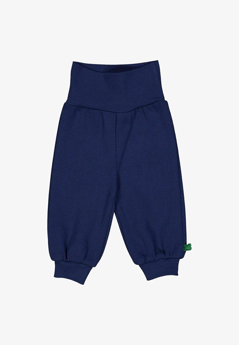 Marineblaue Kinderhosen aus weichem Stoff, mit einem breiten gerippten Bund, elastischen Säumen und einem kleinen grünen Etikett.