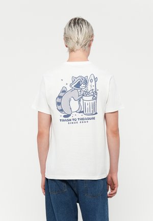 White cotton t-shirt featuring a blue graphic of a raccoon by a trash can, with "Trash to Treasure Since 2009" text below the design.