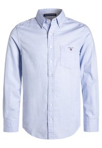 Jasnoniebieska koszula na guziki wykonana z bawełny, z d�ługimi rękawami, kieszenią na piersi oraz haftowanym logo na kieszeni.