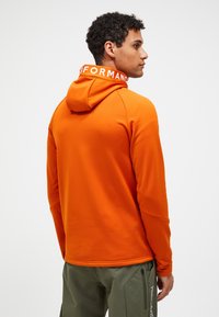 Peak Performance M RIDER - Sportinė striukė - dunkelorange