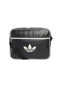 Juodas odinis messenger tipo krepšys su balta apvadu ir dideliu šviesiai pilku Adidas logotipu priekyje. Reguliuojama juoda petneša. Glotni tekstūra.