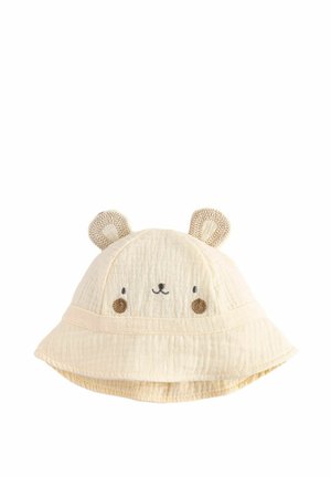 Cappello a secchiello color crema con tessuto testurizzato, caratterizzato da un design con faccia d'orso, orecchie rotonde e dettagli ricamati per gli occhi e il naso.