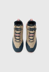Beige and navy hiking shoes with pink accents, featuring a textured upper, sturdy sole, and secure lacing system. Double pull tabs at heel.