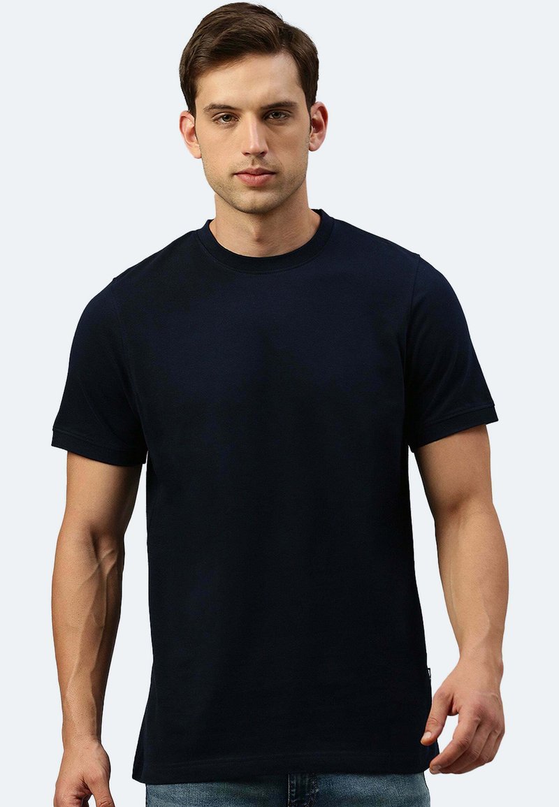 T-shirt a maniche corte blu navy realizzato in cotone, con scollatura a girocollo e design aderente, senza motivi o dettagli visibili.