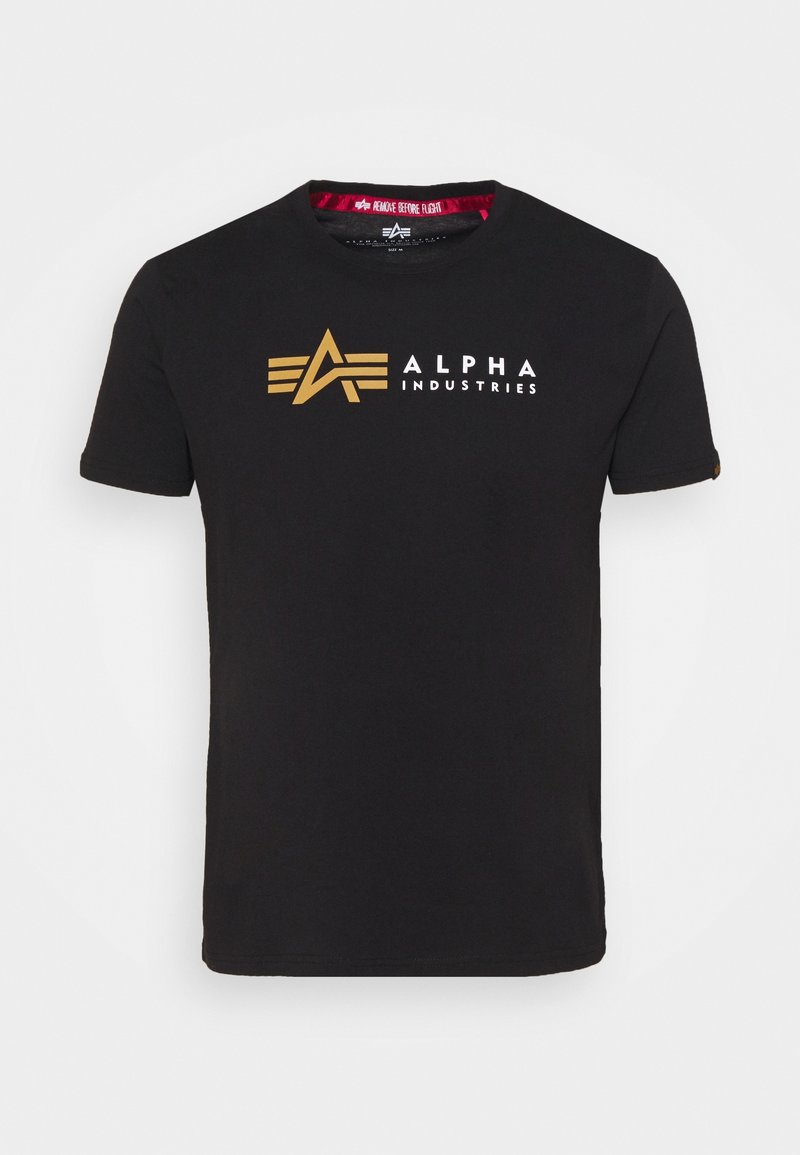 Černé bavlněné tričko s velkým zlatým logem "A" a nápisem "ALPHA INDUSTRIES" v bílé barvě. Krátké rukávy a kulatý výstřih.