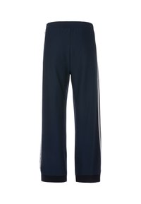 Marineblaue Sporthosen mit relaxed Fit, elastischem Bund und kontrastierenden weißen Seitestreifen. Gerippte Bündchen an den Knöcheln.