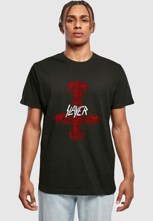 Black cotton t-shirt featuring a red graphic design of a cross with skull accents and the word "SLAYER" in bold, white lettering centered below.