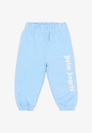 Jasnoniebieskie spodnie dresowe ze ściągaczem w pasie i przy nogawkach, z pionowym białym napisem "Palm Angels" na prawej nogawce.