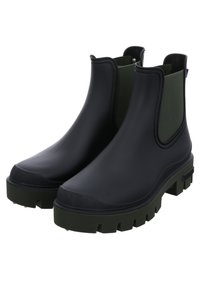 Botas de goma negras hasta el tobillo con paneles laterales de textil verde, suelas anchas y con relieve, y un diseño de punta redondeada. Textura de superficie suave.