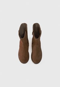 Brown suede ankle boots with a rounded toe, side zipper, and decorative stitching on the top. Smooth interior lining.