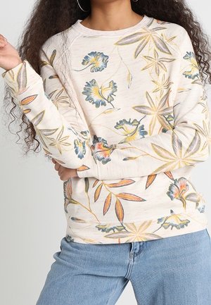 Light beige sweatshirt with colorful floral and leaf patterns. Features long sleeves and a crew neckline. Soft, textured fabric.