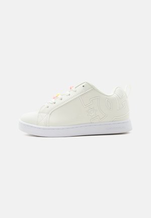White low-top sneaker with embossed logo on the side, white sole, and multicolored lace tips on a plain background.