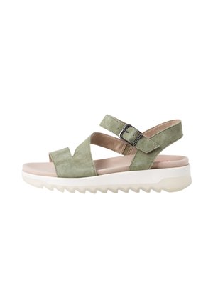 Light green suede open-toe sandal with adjustable ankle strap, cushioned footbed, and thick white ridged sole.