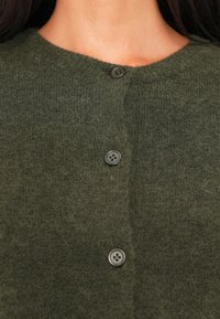 Olive green cardigan with a soft texture, featuring a rounded neckline and three black buttons down the front.