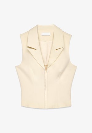Bezrokavna priljubljena brezrokavnik v kremni barvi z širokim ovratnikom in zadrgo spredaj. Gladka tekstura in strukturiran dizajn z diskretnimi krojnimi detajli.