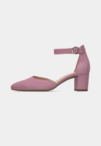 Ροζ σουέτ παπούτσι με χοντρό τακούνι και λουράκι στον αστράγαλο, κλειστή μύτη και λεία υφή. Διαθέτει στρογγυλεμένο μπροστινό μέρος και στιβαρό τακούνι για στήριξη.
