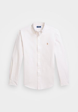 White slim-fit button-down shirt with light blue stripes, featuring a small embroidered logo on the chest and classic collar design.